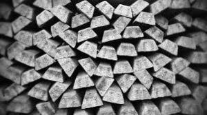 A black and white photo of a pile of wood.