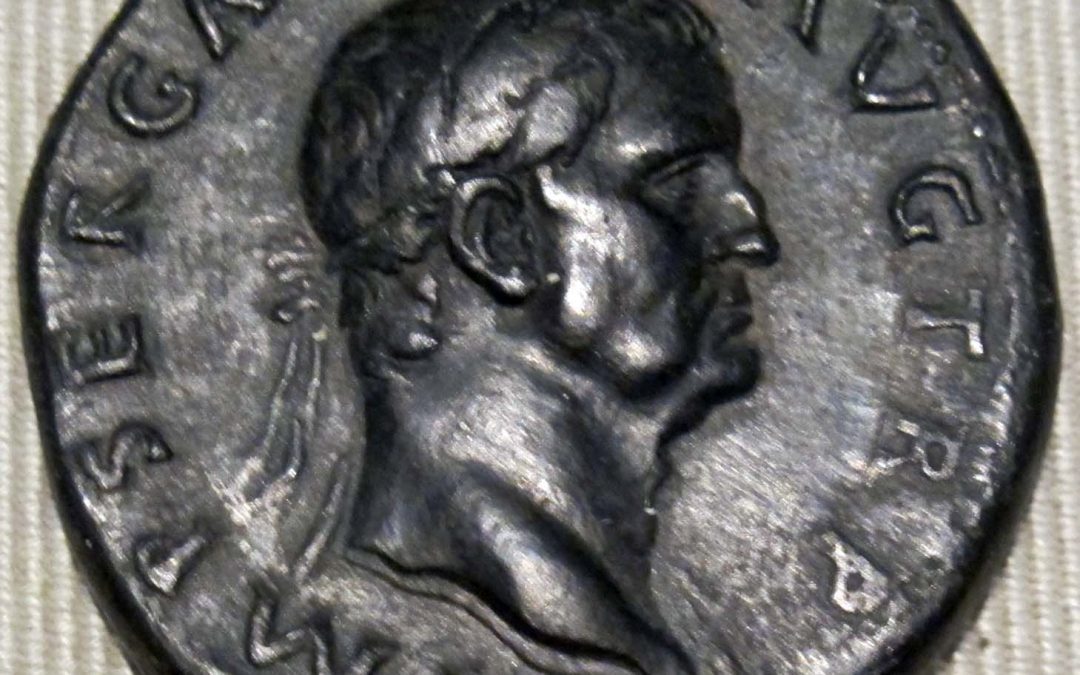 A coin with a portrait of a man.