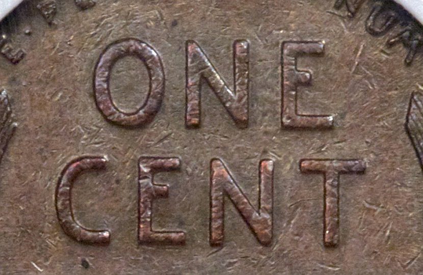 A close up of a one cent coin.