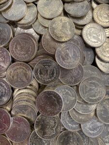 1921 Morgan Dollars A group of silver coins in a plastic container.
